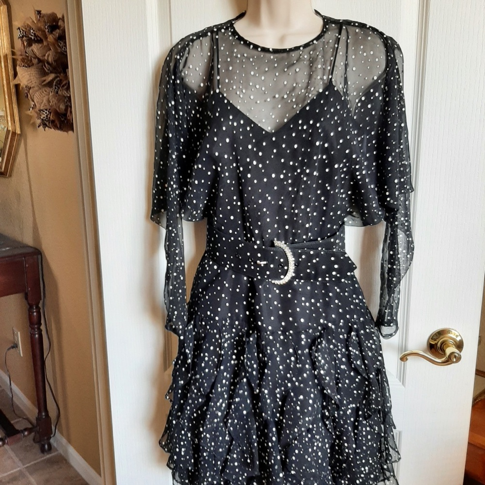 Dress size 4 unusual style,  very elegant & fun to wear.